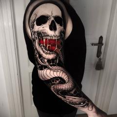 Tatuaże męskie tatuaż wąż i czaszka