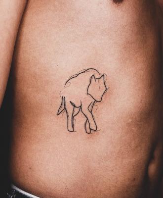 Tatuaż minimalistyczny wilk