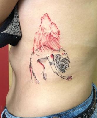 Wilk i kobieta tatuaż